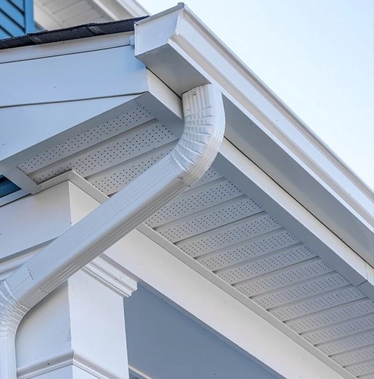 Gutters shown on the side of a residential home